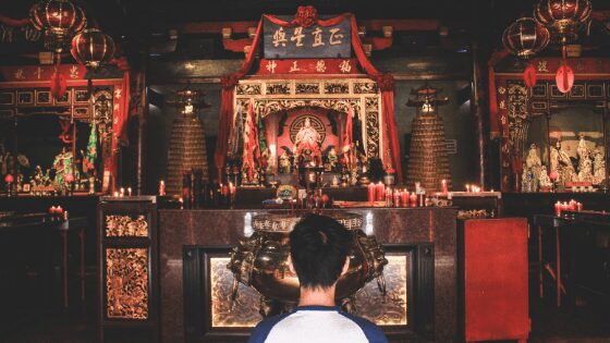 An Indonesian man praying in temple
