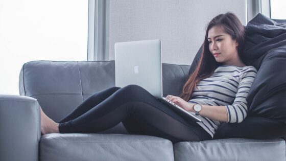 Woman typing on her laptop