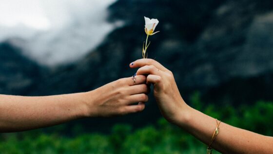 Man giving a flower