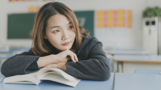 a girl studying in a classroom