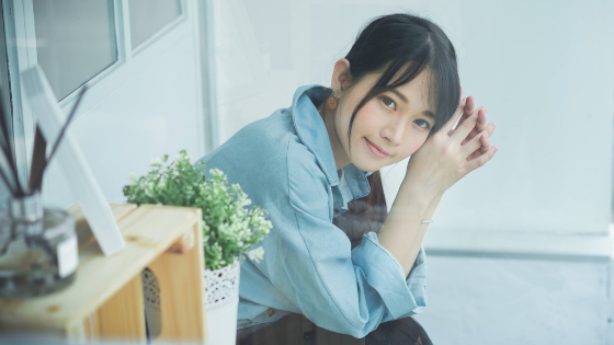 A woman smiling while sitting