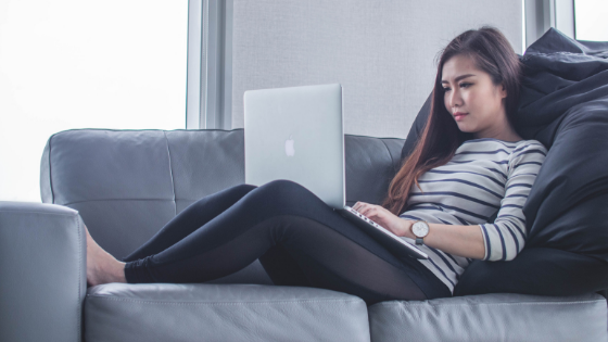 woman typing on her laptop